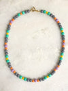 "Necklace Grey surrounded by colours"