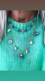 "Necklace Grey surrounded by colours"