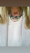 "Necklace Grey surrounded by colours"