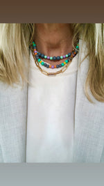 "Necklace Grey surrounded by colours"